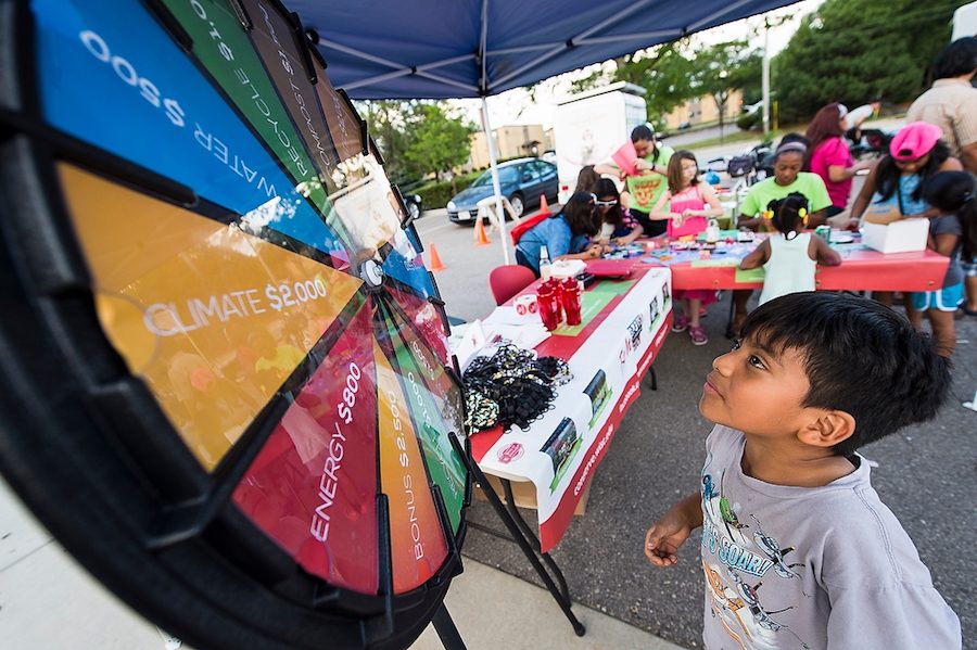 A child plays a conservation quiz game sponsored by UW-Madison's We Conserve program