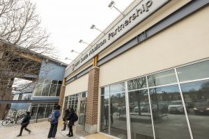 People leave the South Madison Partnership Building