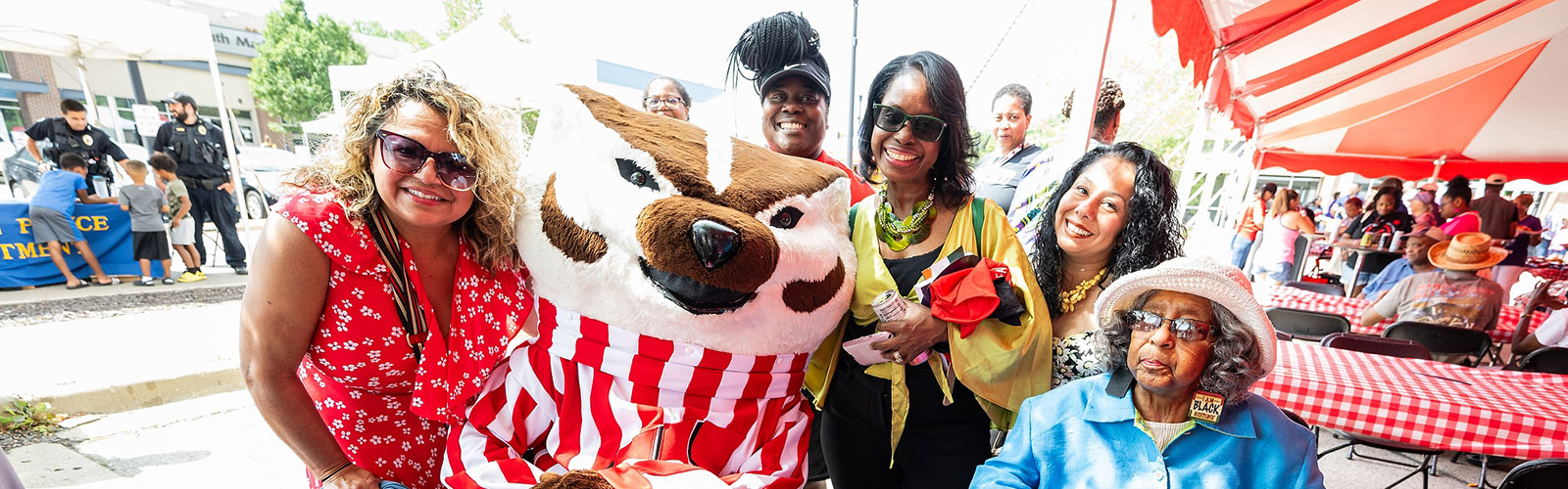 UW–Madison mascot Bucky Badger poses for a photo with attendees during the 9th Annual Unity Picnic held outside the new Black Business Hub at The Village on Park Street in Madison, Wis., on July 22, 2023.
